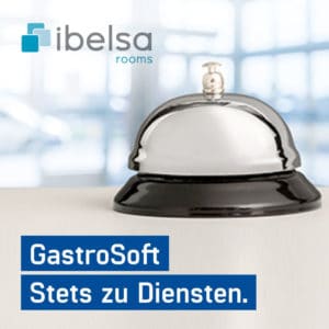 Silbern-schwarze Hotelglocke auf einem Tresen, ibelsa.rooms - Die webbasierte Hotelsoftware - GastroSoft Stets zu Diensten.